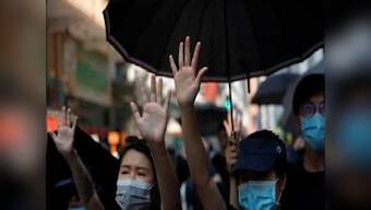 Hong Kong protesters stage sit-in outside school of 18-year-old who was shot by police during protests on Tuesday