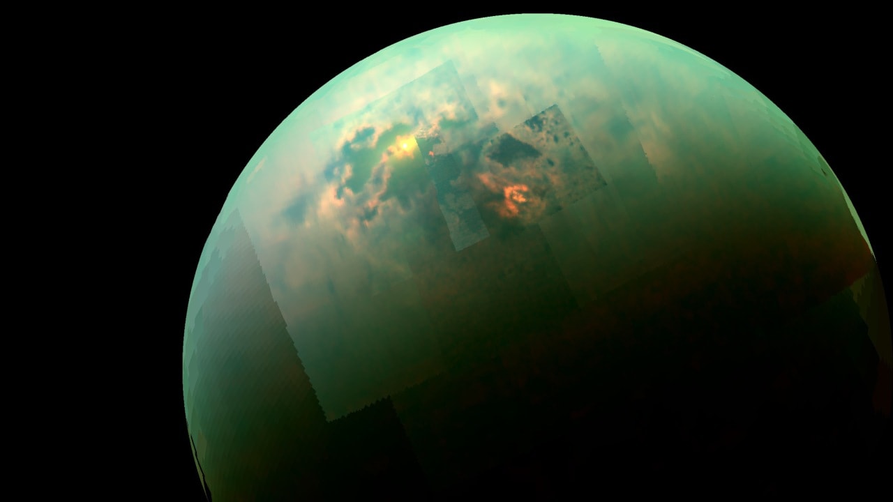Cassini spacecraft catches a glimpse of bright sunlight reflecting off the hydrocarbon seas of Saturn's large moon Titan. Image: NASA