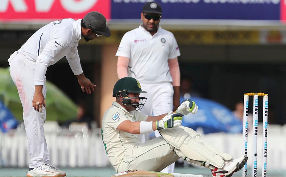 South Africa’s Dean Elgar shows signs of discomfort after being hit on head courtesy an Umesh Yadav delivery. Elgar, who scored 16 runs, was replaced by concussion substitute Theunis de Bruyn. AP 
