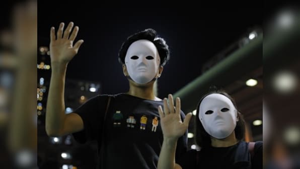 Hong Kong comes to a standstill after protesters stage marches, flashmob protests in defiance of mask ban