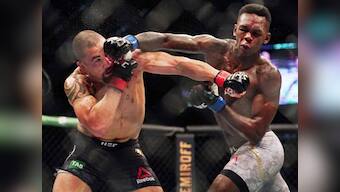 Israel Adesanya knocks out middleweight champion Robert Whittaker in front of record-breaking attendance at UFC 243