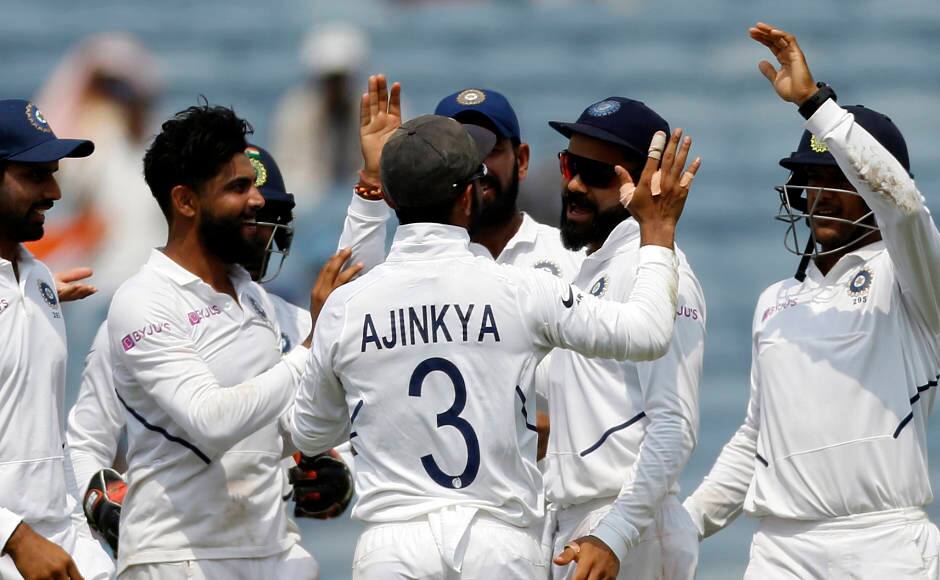 Ravindra Jadeja is all smiles with his teammates after seeing off Temba Bavuma, who scored 38 runs. AP
