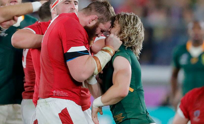 Wales’ Jake Ball and South Africa’s Faf de Klerk scuffle during the Rugby World Cup semi-final. AP Photo