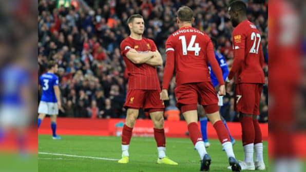 Premier League: Late James Milner penalty takes Liverpool eight points clear in first place; Tottenham rocked by Brighton