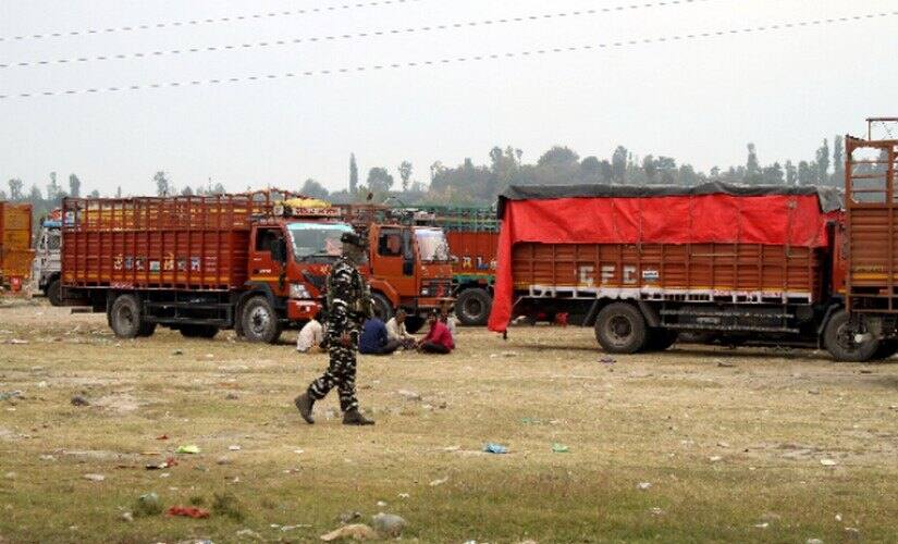 A security personnel patrol the area in Shopian where out-of-state truckers are kept. Image courtesy: Nisar Ul Haq
