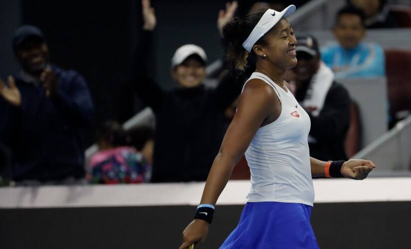 Naomi Osaka smiles after beating Ashleigh Barty in the finals of China Open 2019. AP