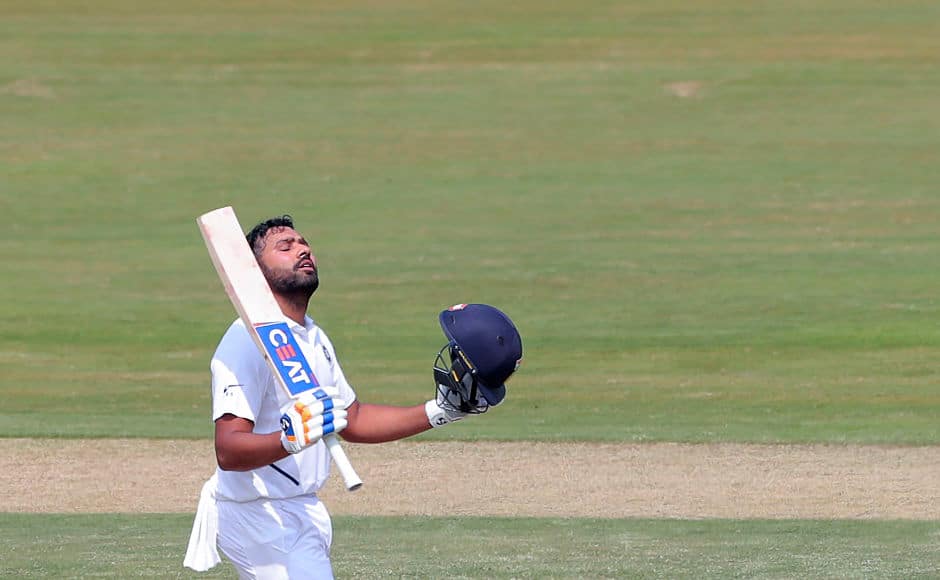Rohit Sharma celebrates after notching up his fourth Test century. This was his first Test playing as an opening batsman, and he remains unbeaten on 115. AP 