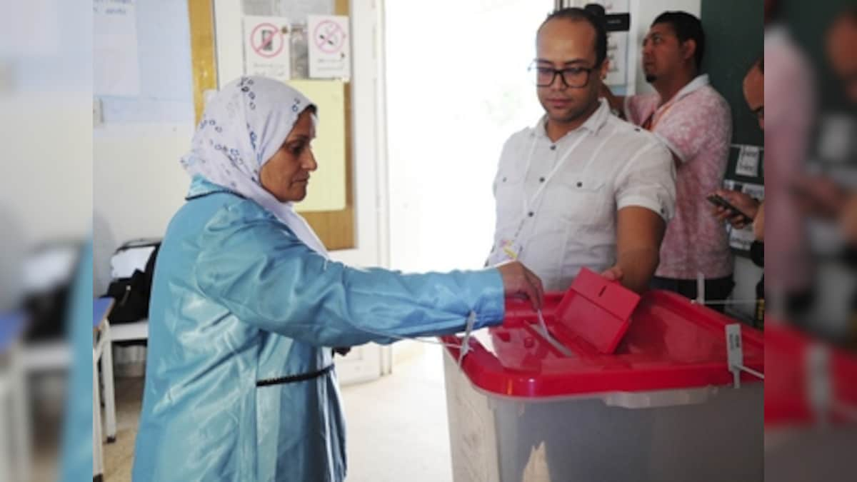 Voting begins for Tunisian presidential runoff; law professor Kais Saied takes on media magnate Nabil Karoui