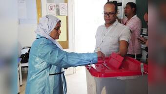 Voting begins for Tunisian presidential runoff; law professor Kais Saied takes on media magnate Nabil Karoui