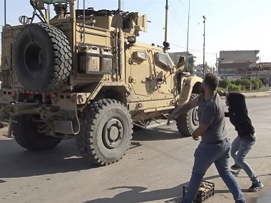 US withdrawal from Syria: Hasty plan met with violence, hostility from locals; American troops accused of ‘running away’ US withdrawal from Syria: Hasty plan met with violence, hostility from locals; American troops accused of ‘running away’