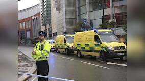 Four injured in stabbing at Manchester shopping mall; suspect in custody of counter-terror police, inquiry on