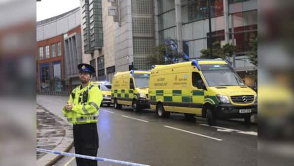 Four injured in stabbing at Manchester shopping mall; suspect in custody of counter-terror police, inquiry on