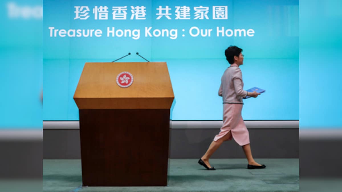 Hong Kong protests: Carrie Lam abandons policy speech as Oppn shouts her down; agitation leader hospitalised after facing attack