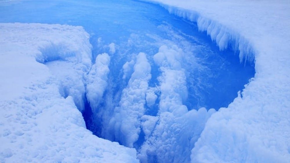Meltwater drains away through a Sanne Bosteels
