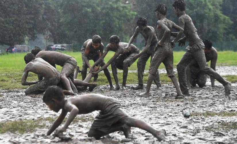 Children playing Kabaddi on water-logged streets in Kolkata. AFP