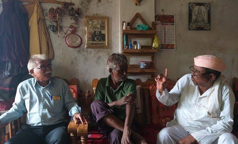 (Left to right) FRA activist Shankar Bharde, sarpanch Rambhau Dhande, local committee president Madhukar Kowee discussing the case. Firstpost/Natasha Trivedi