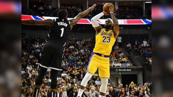 NBA: Kyrie Irving aggravates injury, Brooklyn Nets hold off Los Angeles Lakers in front of 18,000 fans in Shanghai