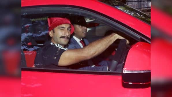 Ranveer Singh spotted wearing a bright red bucket hat to go along with his new Lamborghini Urus in Mumbai