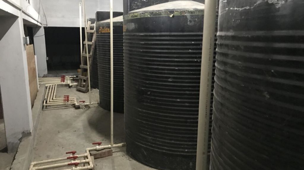 Water tanks on the top floor of a building in northern Thimphu. Photo credit: Yuexuan Chen.