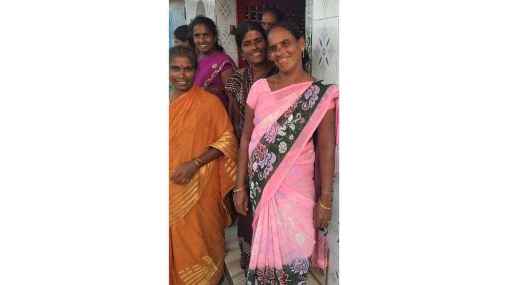 M Narsamma, in the brown saree, and K Uma in pink, gather at the temple to discuss preparedness. Photo by Sahana Ghosh.