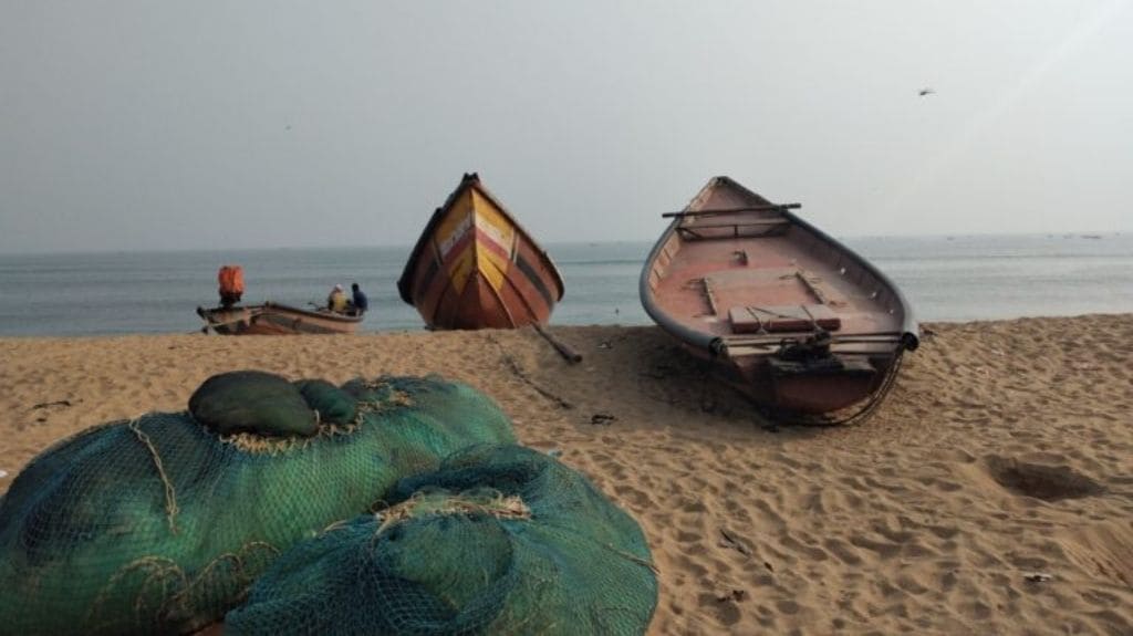 Boats and fishing gear destroyed by Fani lie along the beach beside the slum. Photo by Sahana Ghosh.