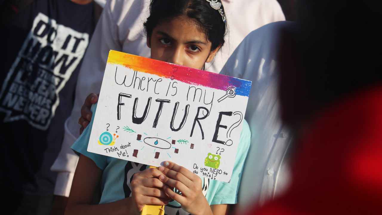 A young protester takes part in a rally against climate change in Mumbai on 24 May 2019. Image: Getty