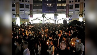 Thousands gather in Hong Kong to mourn student who died during recent clashes, oppose arrest of seven pro-democracy lawmakers