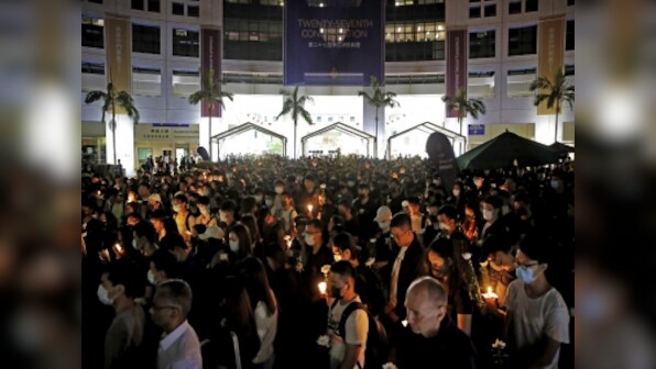 Thousands gather in Hong Kong to mourn student who died during recent clashes, oppose arrest of seven pro-democracy lawmakers