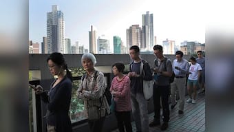 Hong Kong votes in election amid heavy police deployment; ruling camp, Beijing hope for support following disruption caused by anti-govt stir