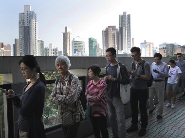 Hong Kong votes in election amid heavy police deployment; ruling camp, Beijing hope for support following disruption caused by anti-govt stir Hong Kong votes in election amid heavy police deployment; ruling camp, Beijing hope for support following disruption caused by anti-govt stir