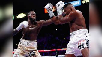 Deontay Wilder defeats Luis Ortiz with seventh-round knockout to retain heavyweight title ahead of Tyson Fury rematch
