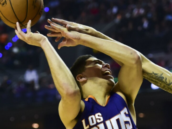 NBA: Devin Booker helps Suns end Sixers' unbeaten run; Golden State Warriors record first win at new home arena