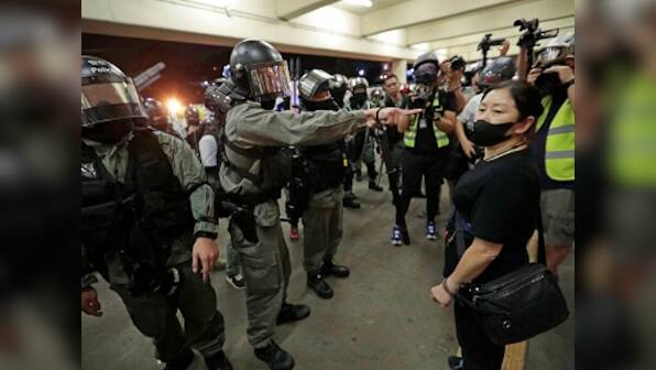 Riot police in Hong Kong storms shopping malls  to thwart protests; at least five injured in knife attack, two in critical condition