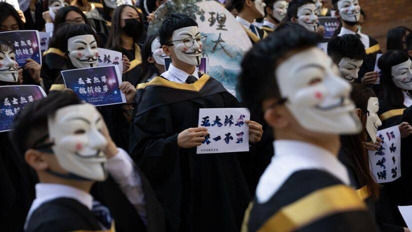 Students wear Guy Fawkes masks during a protest on November 5 in Hong Kong. Image courtesy Jerome Favre/ EPA/ The Conversation