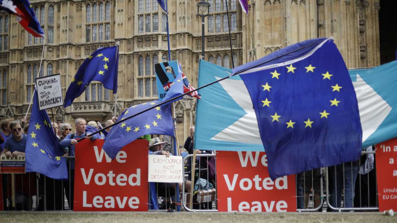 Leave and remain supporters try to block each others' banners as they protest opposite Parliament Square in London. Internet companies say they’re working to fight misinformation ahead of next month’s general election in the United Kingdom, but bogus online claims and misleading political ads remain a threat due to government inaction. Image: AP