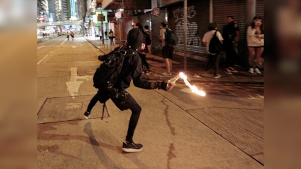Hong Kong protests: Agitators attack Chinese news agency Xinhua's office; police fire tear gas to deter people from hurling gasoline bombs