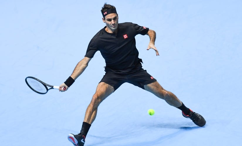 Roger Federer returns to Novak Djokovic during their ATP World Tour Finals singles tennis match at the O2 Arena in London. AP