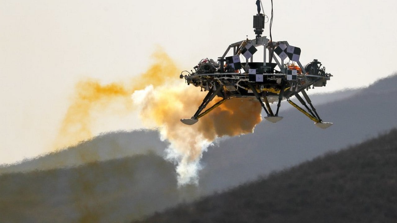 A lander is lifted during a test of hovering, obstacle avoidance and deceleration capabilities at a facility in Huailai in China's Hebei province. Image credit: AP