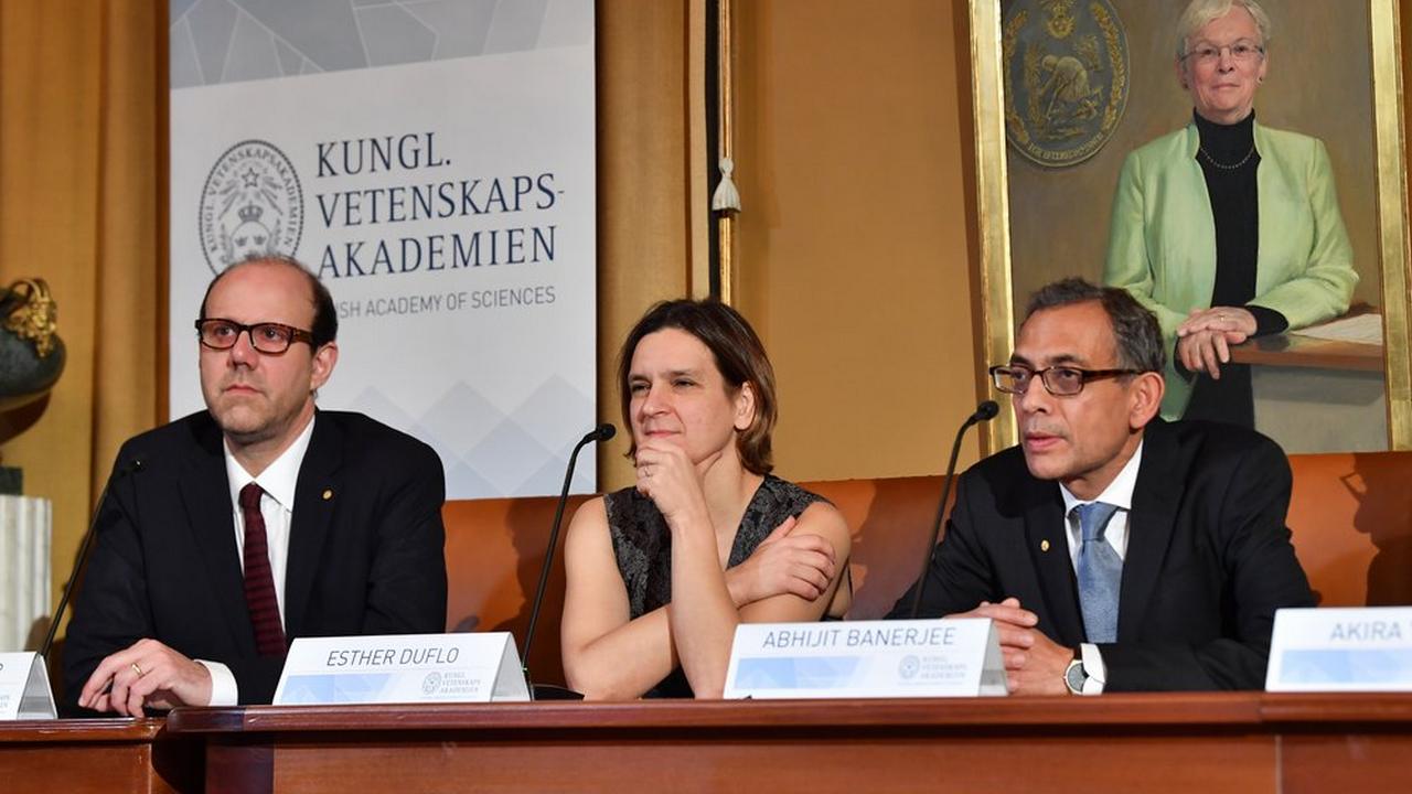 From left, Nobel Laureates in Economic Sciences Michael Kremer, Esther Duflo and Abhijit Banerjee attend a press conference at the Royal Swedish Academy of Sciences in Stockholm. Image credit: AP