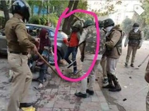 Identity of 'guy in red shirt' lathi-charging Jamia students remains murky: RSS volunteer, police constable or someone else? Identity of 'guy in red shirt' lathi-charging Jamia students remains murky: RSS volunteer, police constable or someone else?