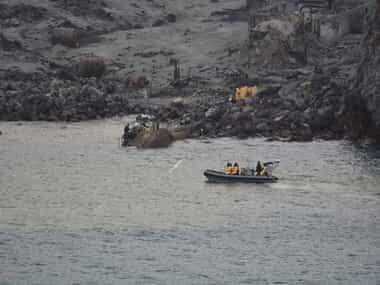 Six days after volcanic eruption in New Zealand's White Island, toxic gases, low visibility hamper search for victims