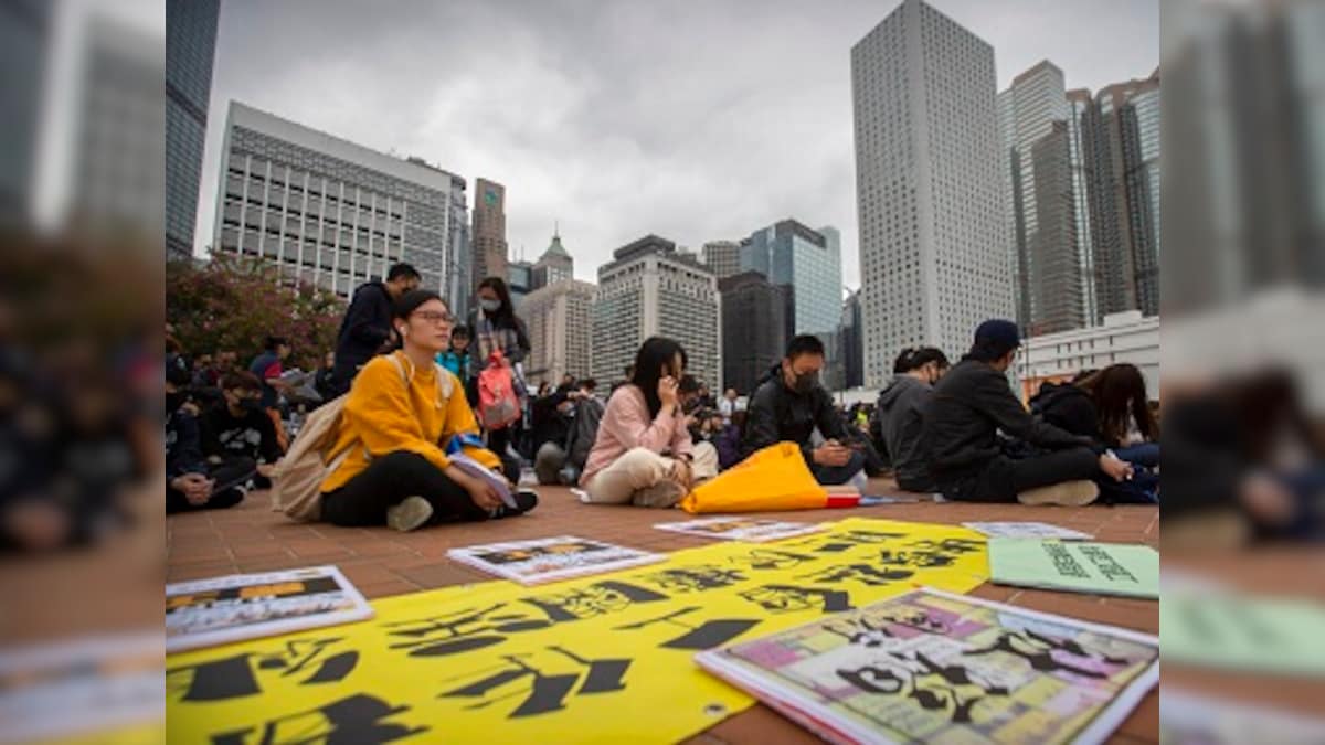 Protests flare up at Hong Kong shopping malls; demonstrators scuffle with riot police as Carrie Lam visits Beijing