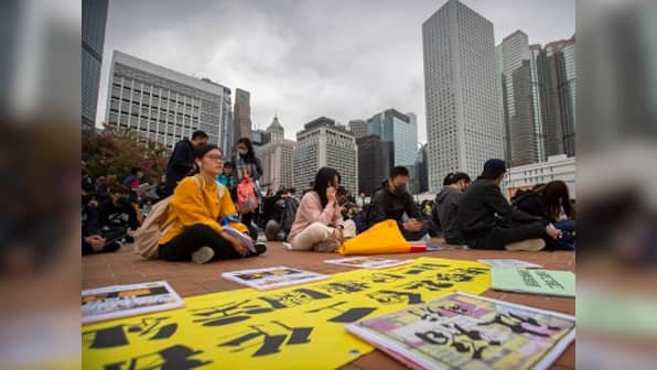 Protests flare up at Hong Kong shopping malls; demonstrators scuffle with riot police as Carrie Lam visits Beijing