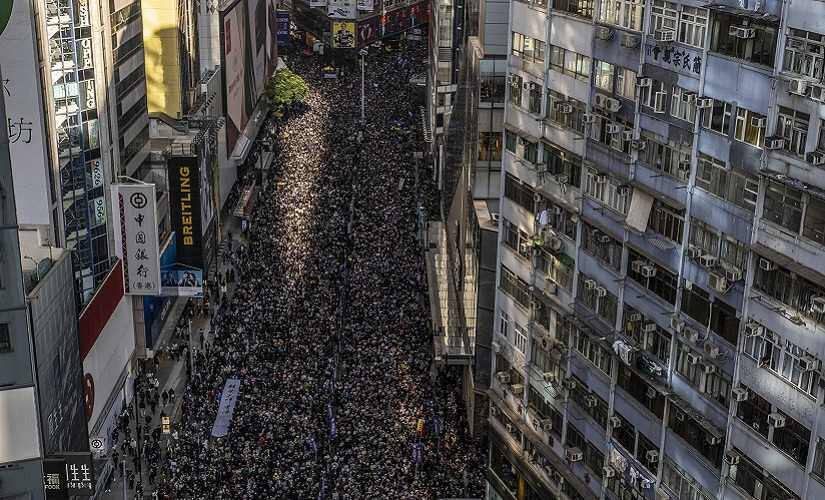 Hundreds of thousands of people poured into Hong Kong’s major thoroughfares for an authorised march meant to coincide with the United Nations Human Rights Day. Lam Yik Fei © 2019 The New York Times
