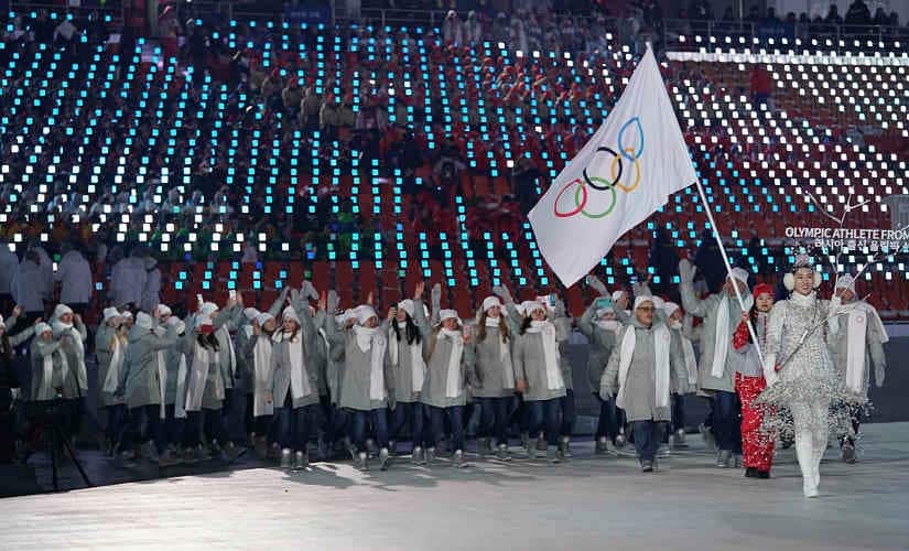 Russian athletes march behind the Olympic flag at the opening ceremony of the 2018 Winter Olympics. By Doug Mills © 2019 The New York Times