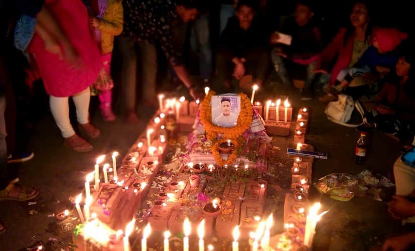 Locals pay tribute to Sam Stafford killed in firing during Assam protests. Image courtesy: Niloy Bhattacherjee