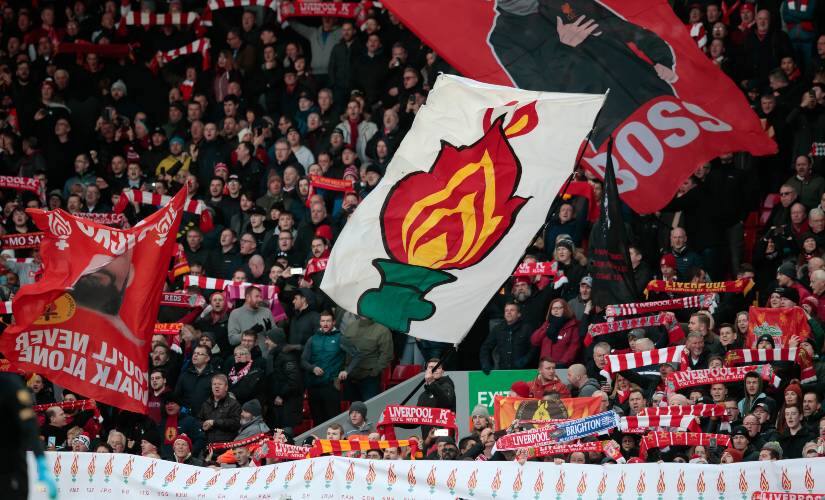 Fans hold up tributes to the victims of the Hillsborough disaster before the English Premier League match between Liverpool and Brighton. AP