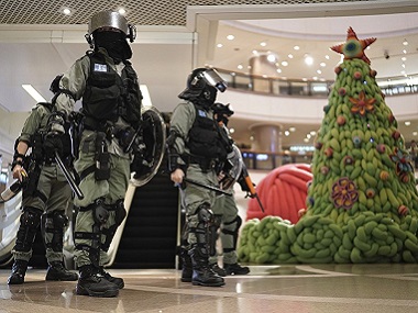 Hong Kong protests resume in shopping centres, streets: Demonstrators don Santa hats, clash with police in Mong Kok district Hong Kong protests resume in shopping centres, streets: Demonstrators don Santa hats, clash with police in Mong Kok district