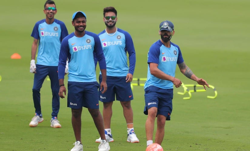 India’s captain Virat Kohli, right along with teammates warmup with ball during a training session ahead of their first T20 against West Indies, in Hyderabad. AP