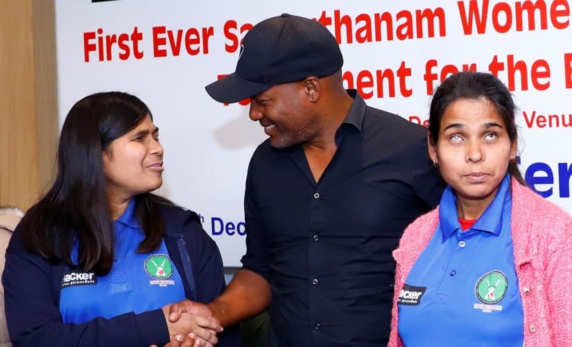 Delhi Blind Women’s team Captain Ankitha (Left) shakes hand with Brian Lara at the press conference of the Women’s National Cricket Tournament for the Blind in Delhi on Saturday. 